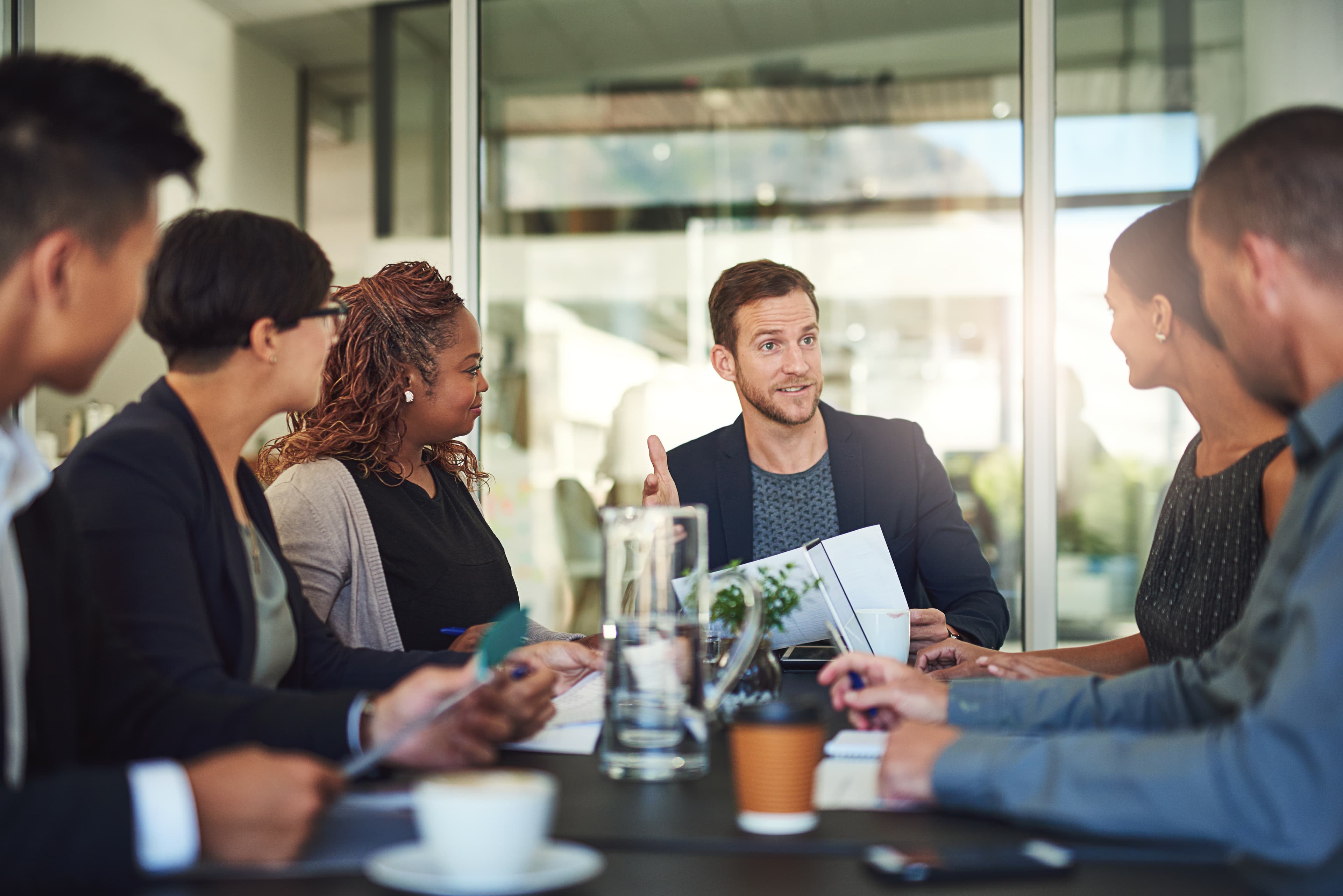 Business professionals in commercial meeting